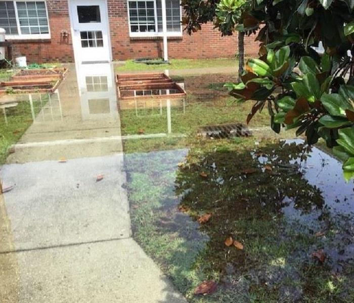 flooded grounds at a facility, drain clogged