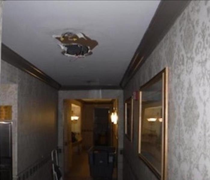 hole in ceiling from a broken sprinkler head