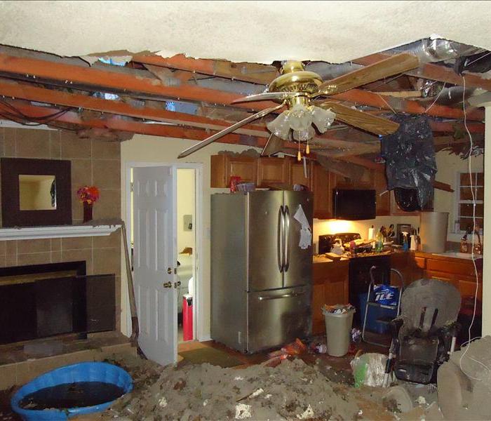 missing ceiling and mess in kitchen