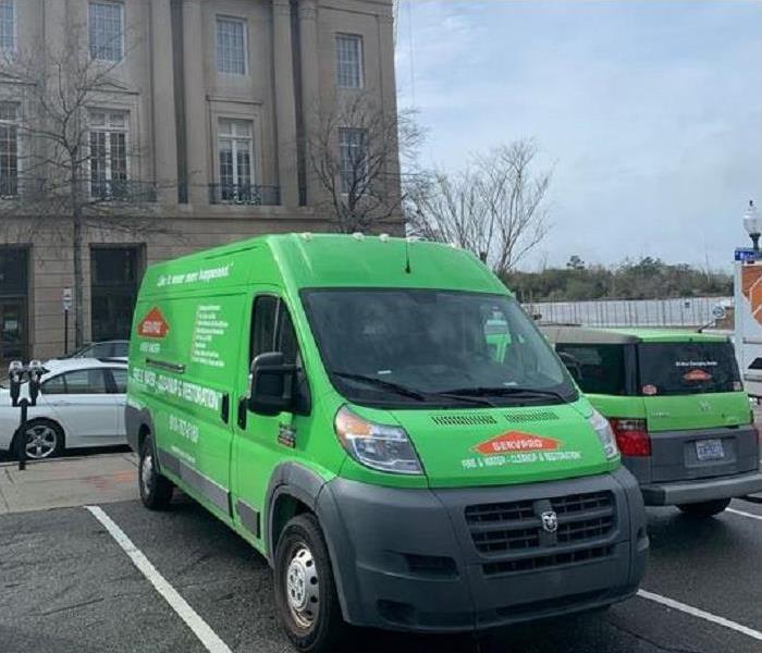 SERVPRO vehicle parked in front of commercial building.