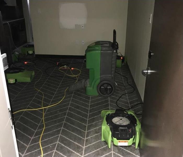 SERVPRO restoration equipment being used in water damaged commercial property.