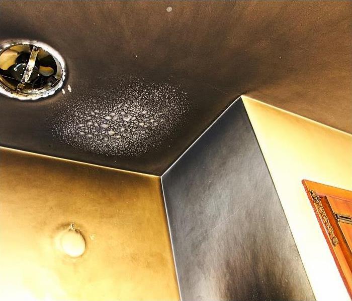 Smoke and soot on walls and ceiling